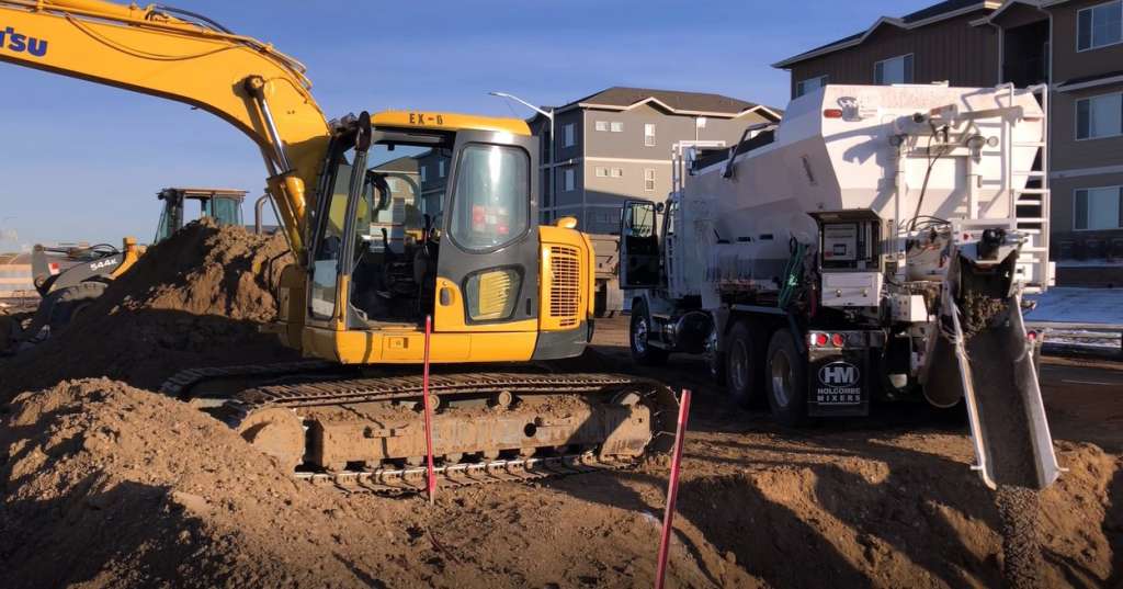 Flowable Fill Volumetric Mixer Truck backfilling in a residential area