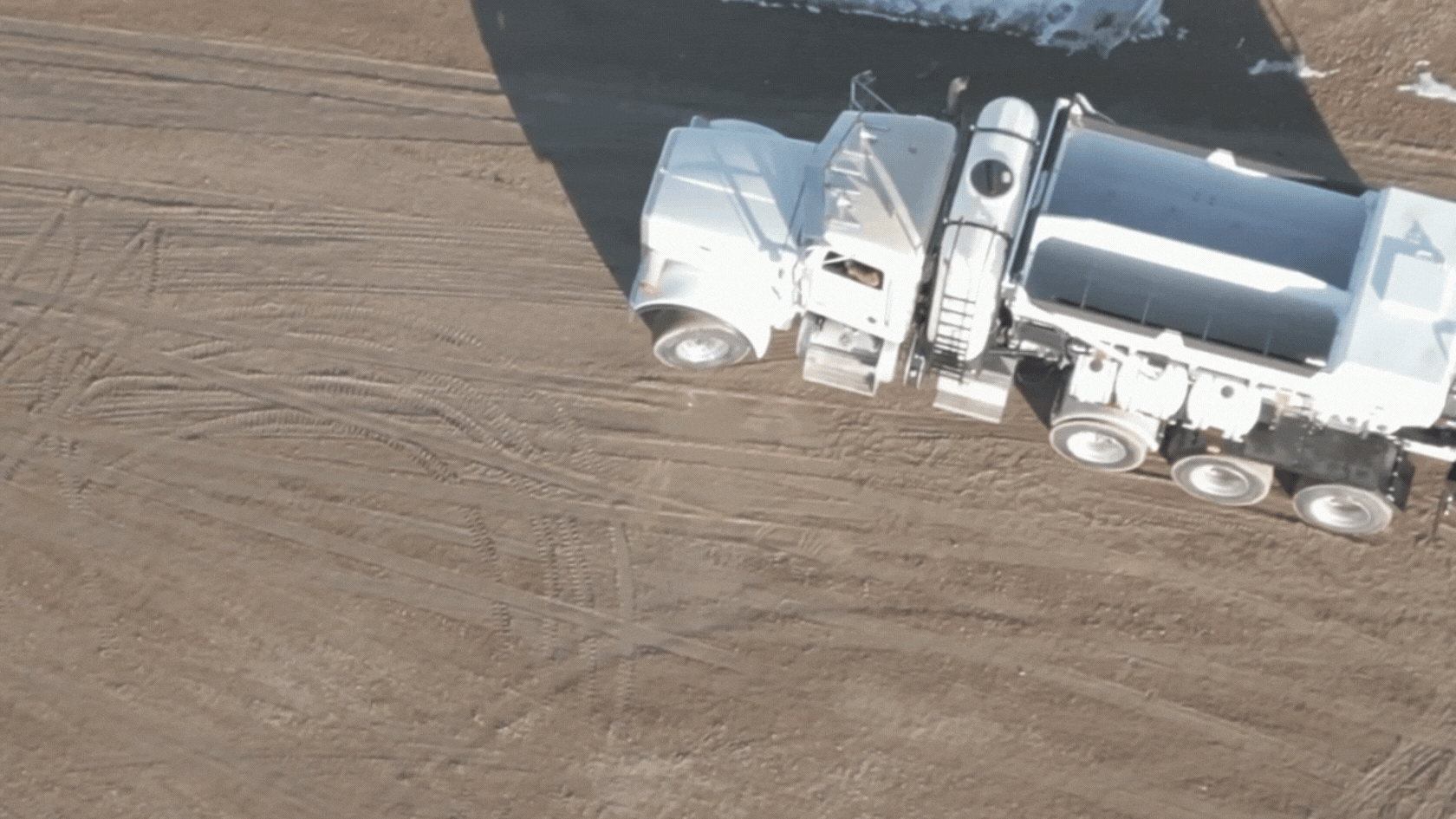 Volumetric Concrete Mixer, Driving Away Drone View at Holcombe Mixers
