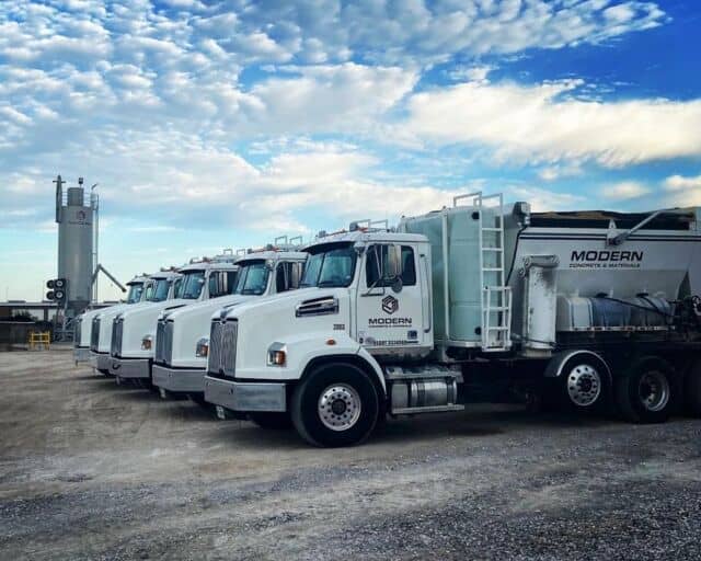 “Pretty ladies, all in a row…”. Modern Concrete’s Holcombe Mixers lined up and ready for the next job.  In the background you can see a cement silo, also available for purchase from Holcombe Mixers. 📸 credit: @modern.concrete  Click on the link in our bio to learn more about how Holcombe Mixers can start saving your business time and money by producing your own concrete.
